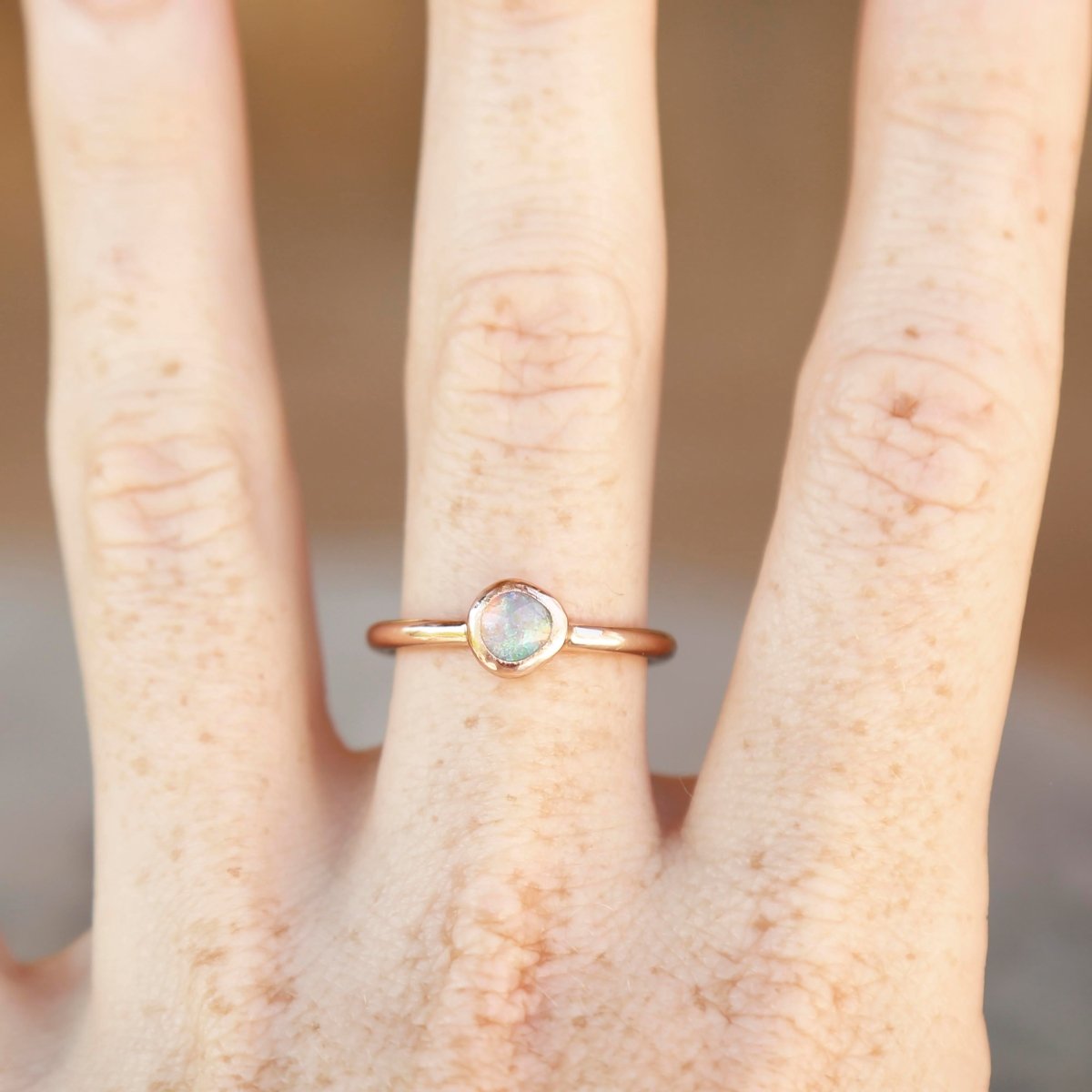 wearing an opal ring