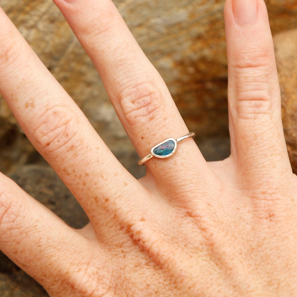 wearing a handmade Opal Ring